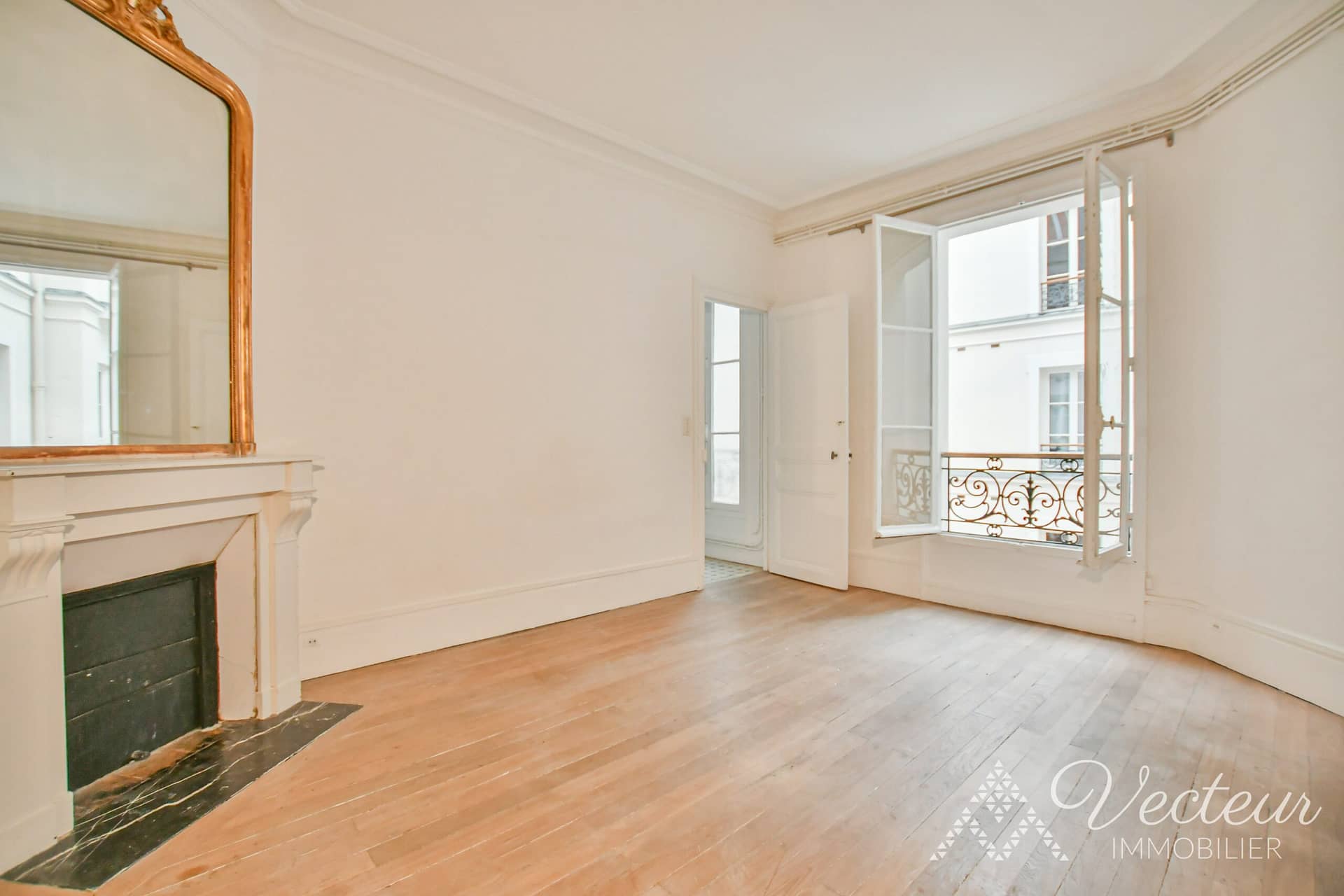 Chambre avec cheminée d'un appartement à Paris 16